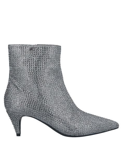 michael kors silber schuhe|Michael Kors silver boots.